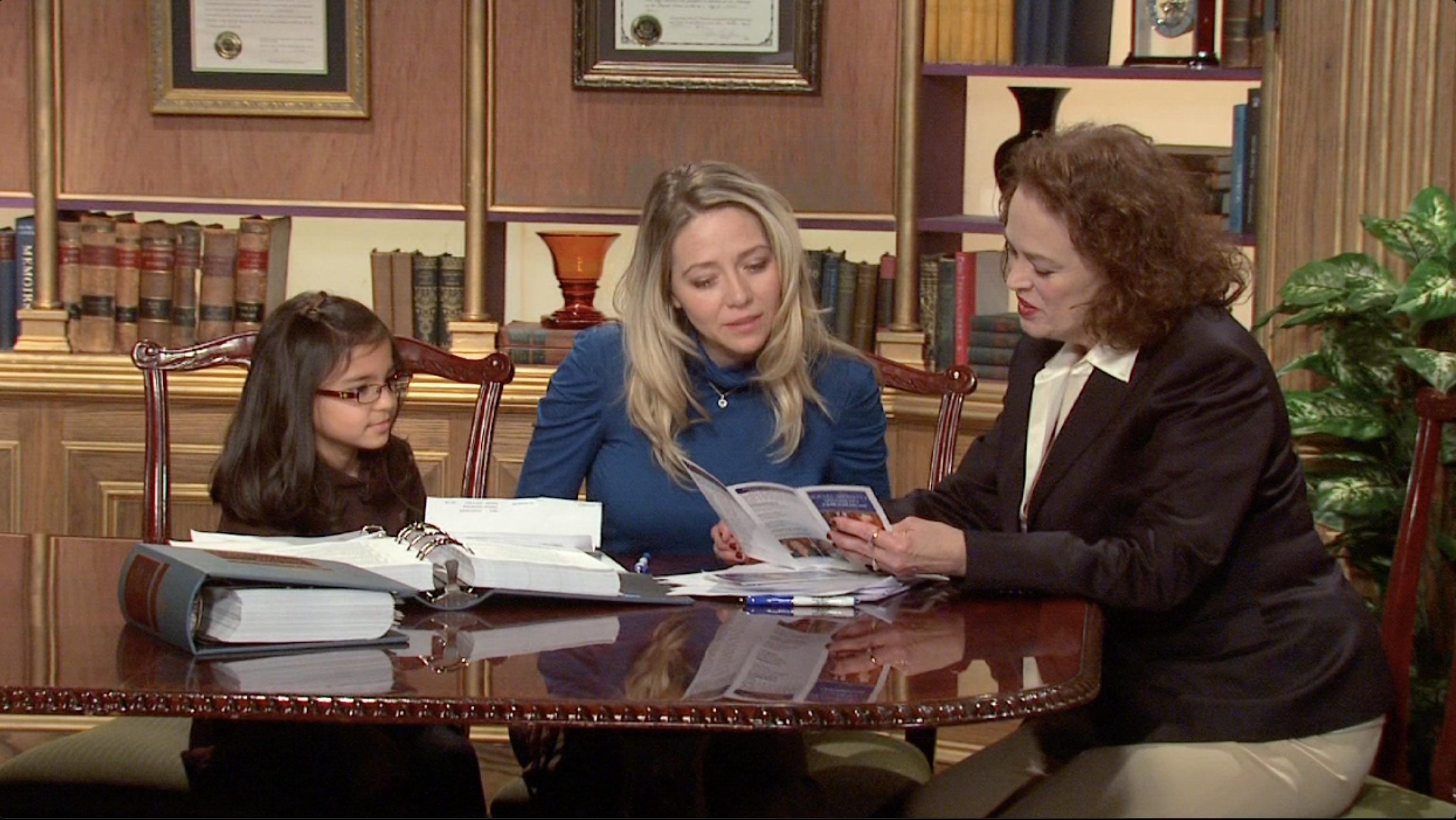 flora and family at desk