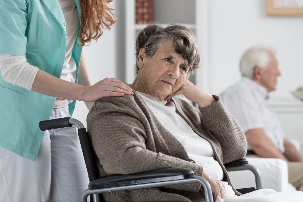 nh sad woman wheelchair