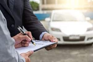 Insurance Adjustor With Accident Victim