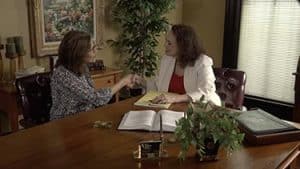 flora handing over settlement check