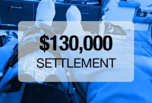 A person with a leg brace and bandaged foot rests on a couch. Text overlay reads "$130,000 Settlement." Putnam County Accident Injury Lawyers helped secure this settlement for their client.
