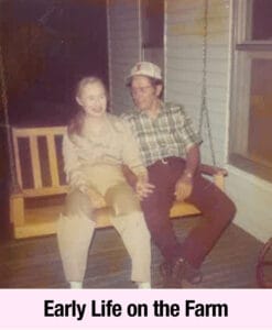 An older man and woman sit together on a wooden porch swing, holding hands and smiling. The image is captioned "Early Life on the Farm," capturing a moment of warmth and empowerment reminiscent of Elise Talmage Lieb’s Southern Belle charm.