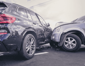Two SUVs involved in a collision on a paved road in Elizabethtown KY, with one vehicle’s front end impacting the side of the other. Car Accident Lawyers can help guide you through the legal process after such incidents.