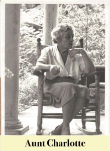 An older woman sits in a wooden chair on a porch, wearing a blouse and skirt, with her legs crossed and looking to the side. Text below reads "Aunt Charlotte—descendant of Virginia Settlers.