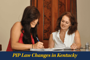 Two women sit at a table reviewing and signing documents, with a caption below that reads, “PIP Law Changes in Kentucky.”.
